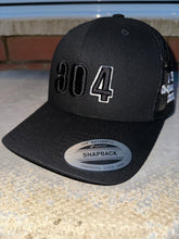 Load image into Gallery viewer, Black trucker cap with UFC 304 logo

