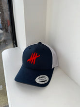 Load image into Gallery viewer, Navy &amp; white trucker cap with white &amp; red logo
