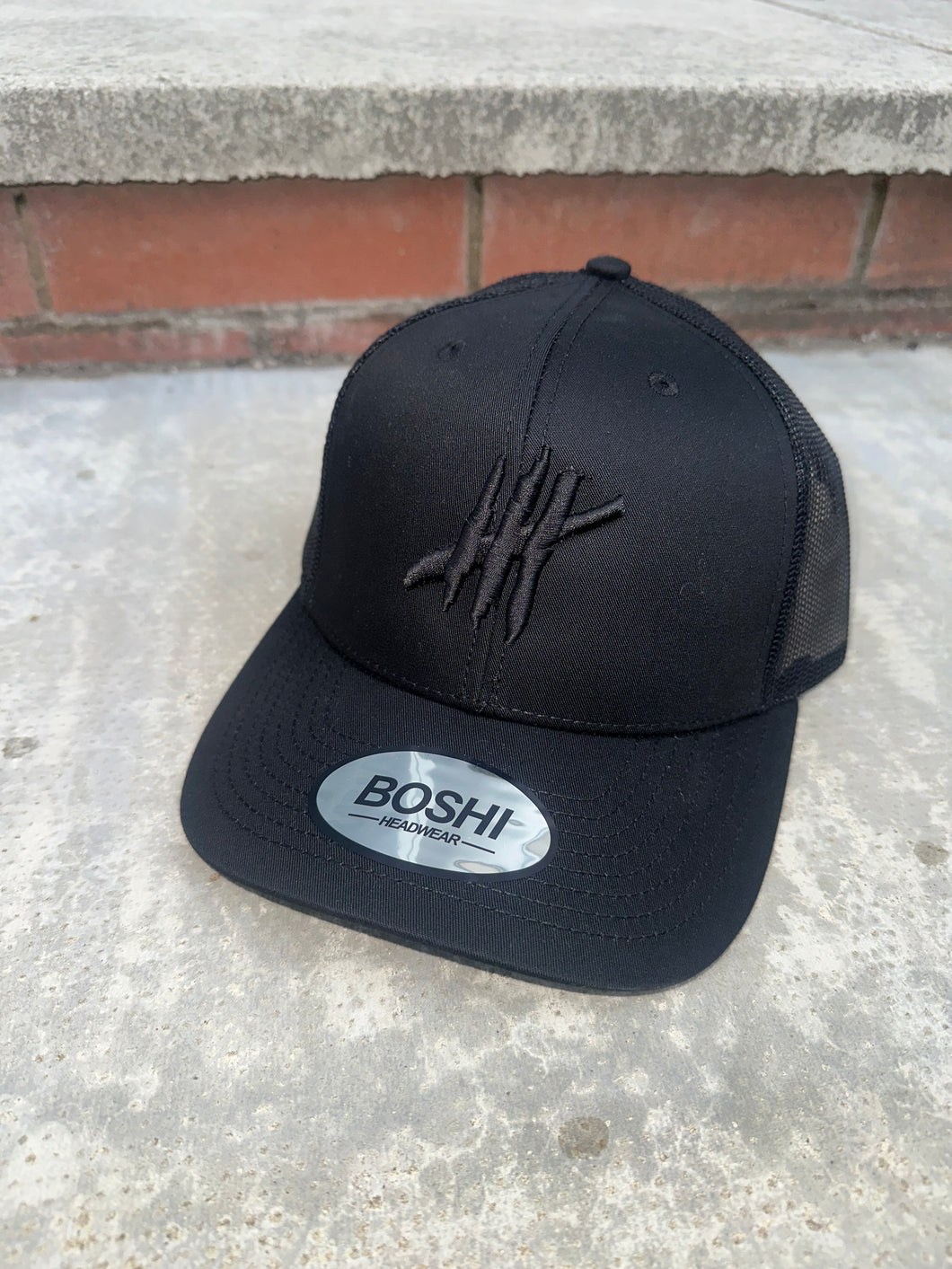 New Black trucker with black logo