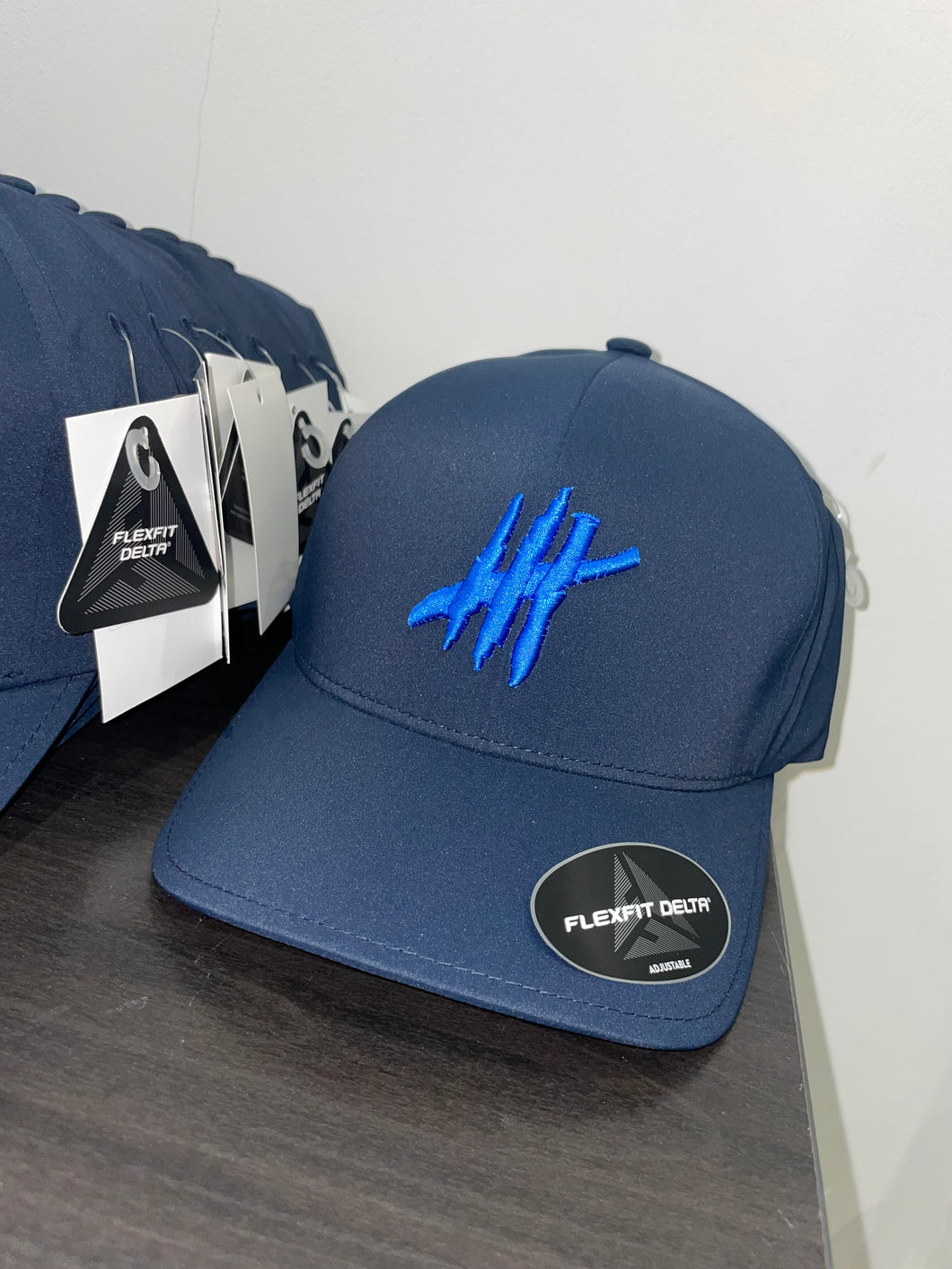 Navy delta flexfit cap with blue logo