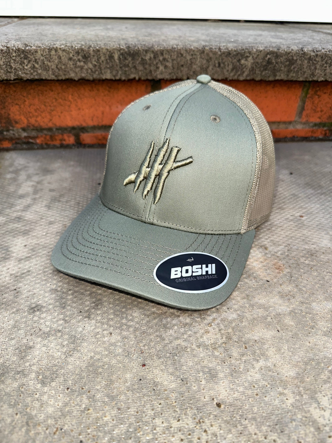 New sage green trucker cap with sage logo