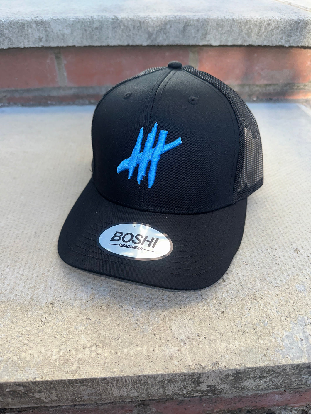 New Black trucker with light blue logo