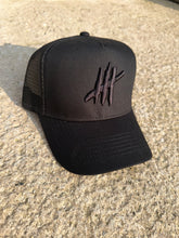 Load image into Gallery viewer, Black trucker youths cap with grey logo
