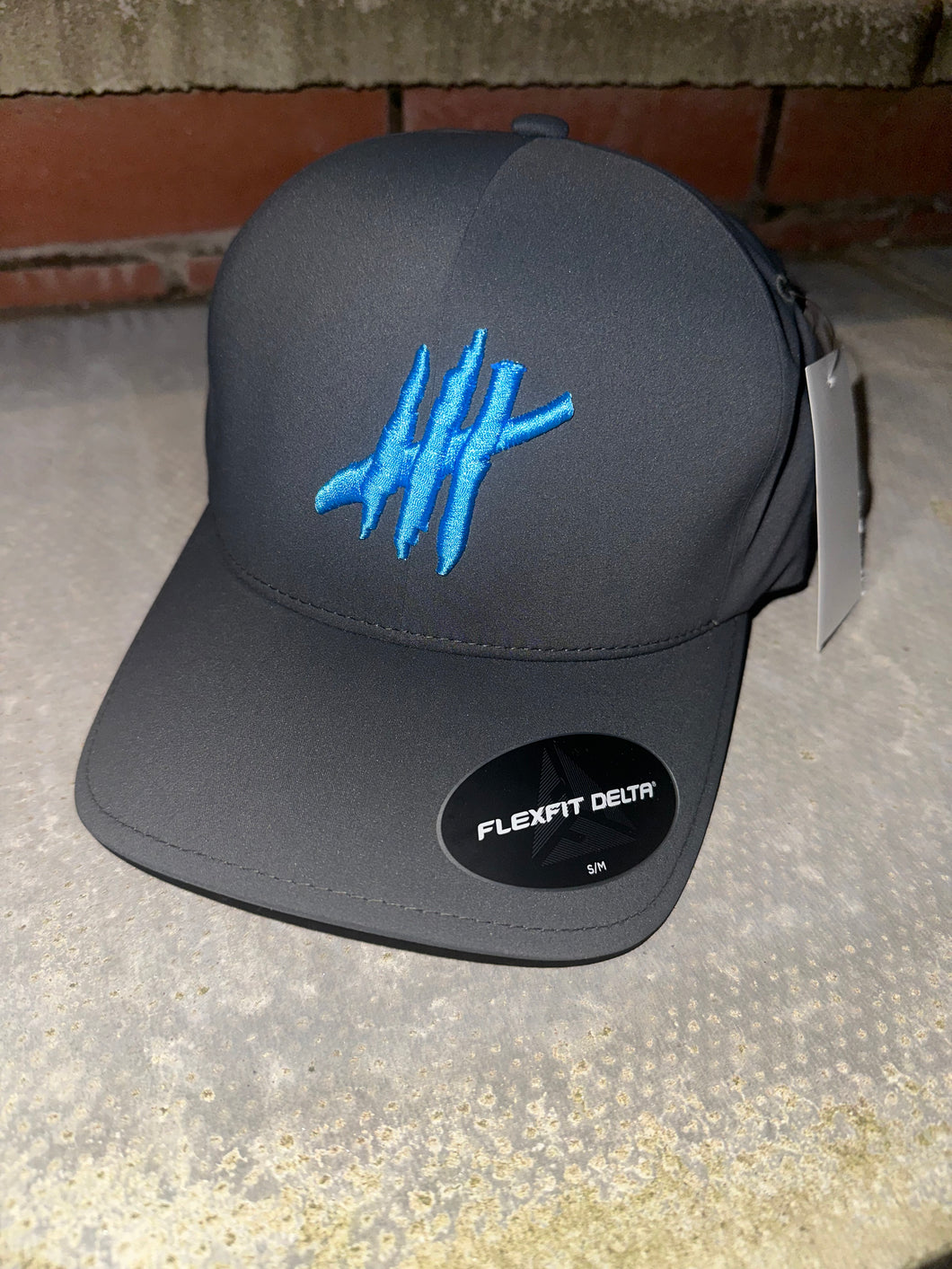Charcoal delta flexfit cap with light blue logo