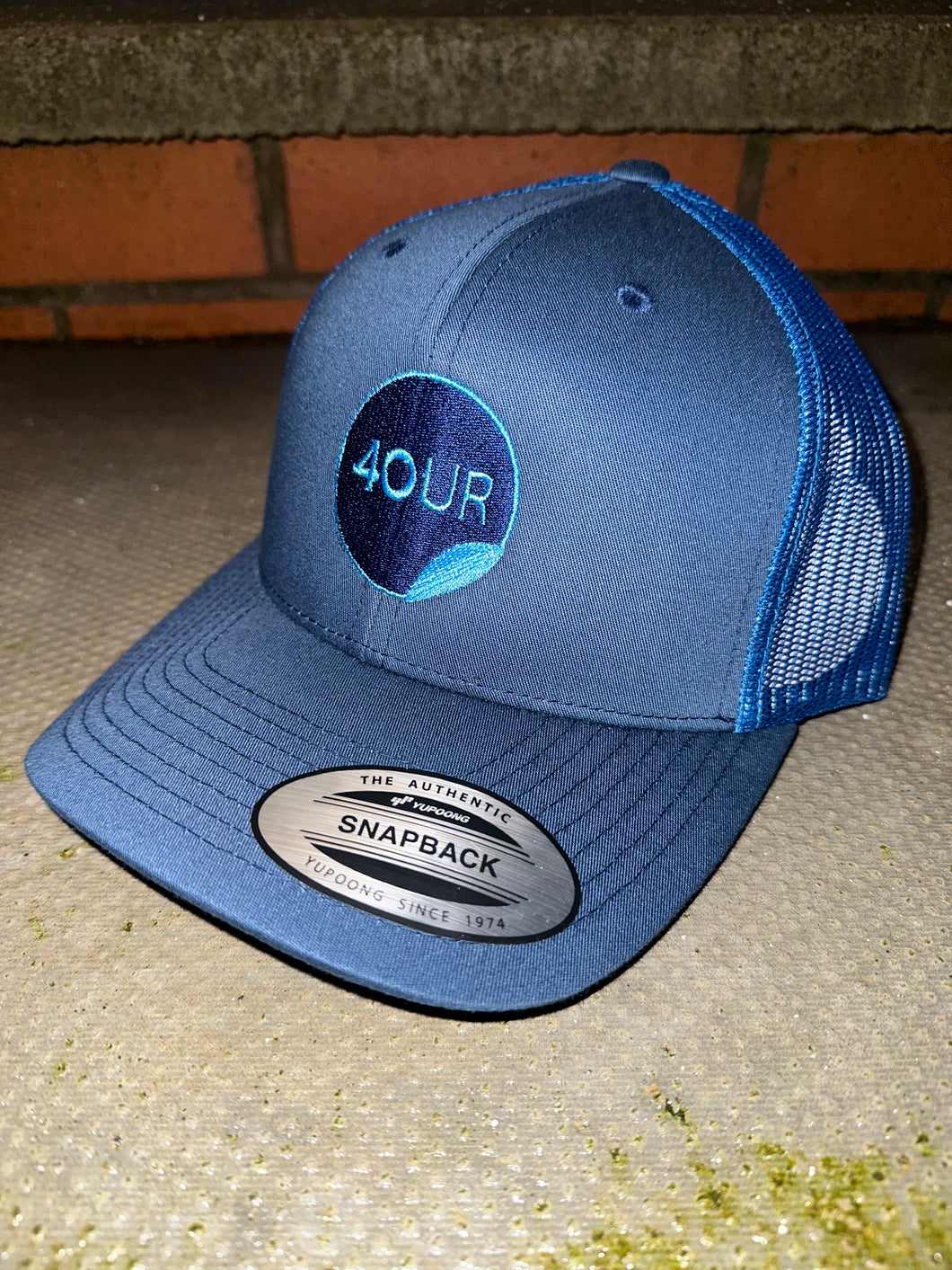 Navy & blue trucker cap with light blue & navy logo