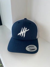 Load image into Gallery viewer, Navy &amp; white trucker cap with white logo
