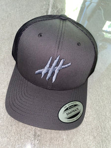 Dark grey trucker cap with grey logo