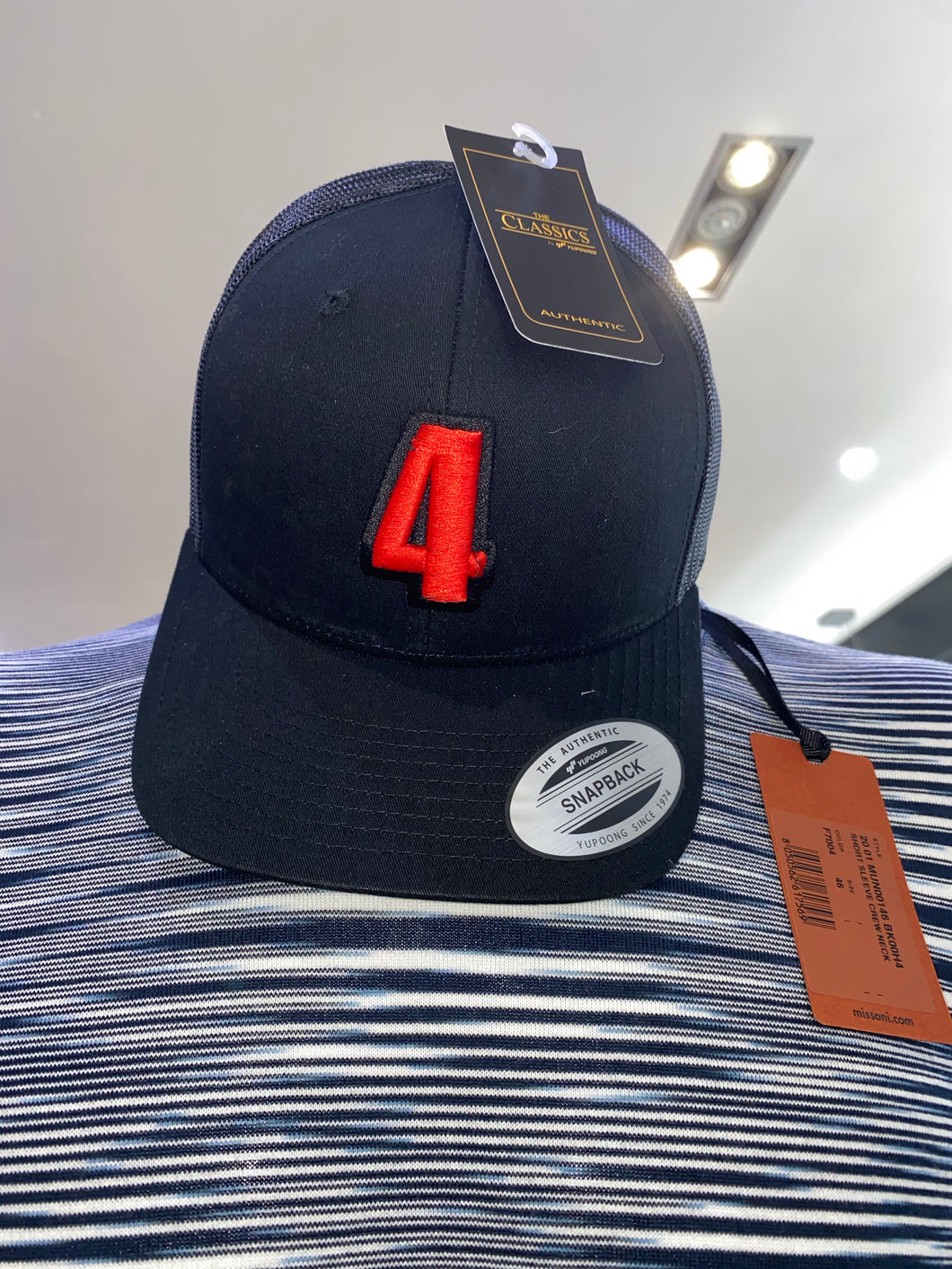 Black trucker cap with red logo