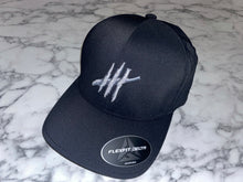 Load image into Gallery viewer, Black delta flexfit cap with sliver logo
