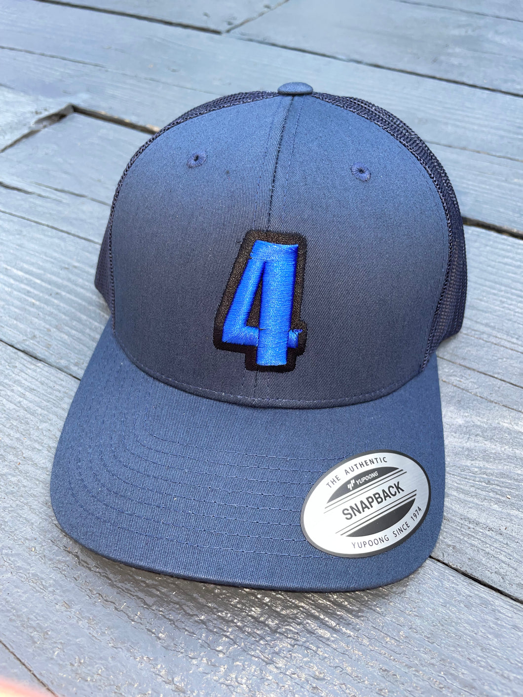 Navy trucker with blue & black logo